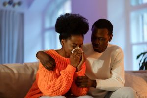 Loving husband comforting crying wife ask for forgiveness or give support and sharing grief or loss